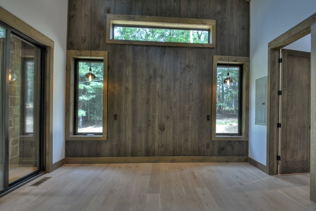 2596 Hwy 2 Blue Ridge Blue Ridge, GA 30513 - Photo 17 of 56 an empty room with wooden floor windows and entrance
