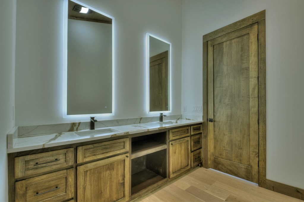 2596 Hwy 2 Blue Ridge Blue Ridge, GA 30513 - Photo 19 of 56 a bathroom with a double vanity sink and a mirror