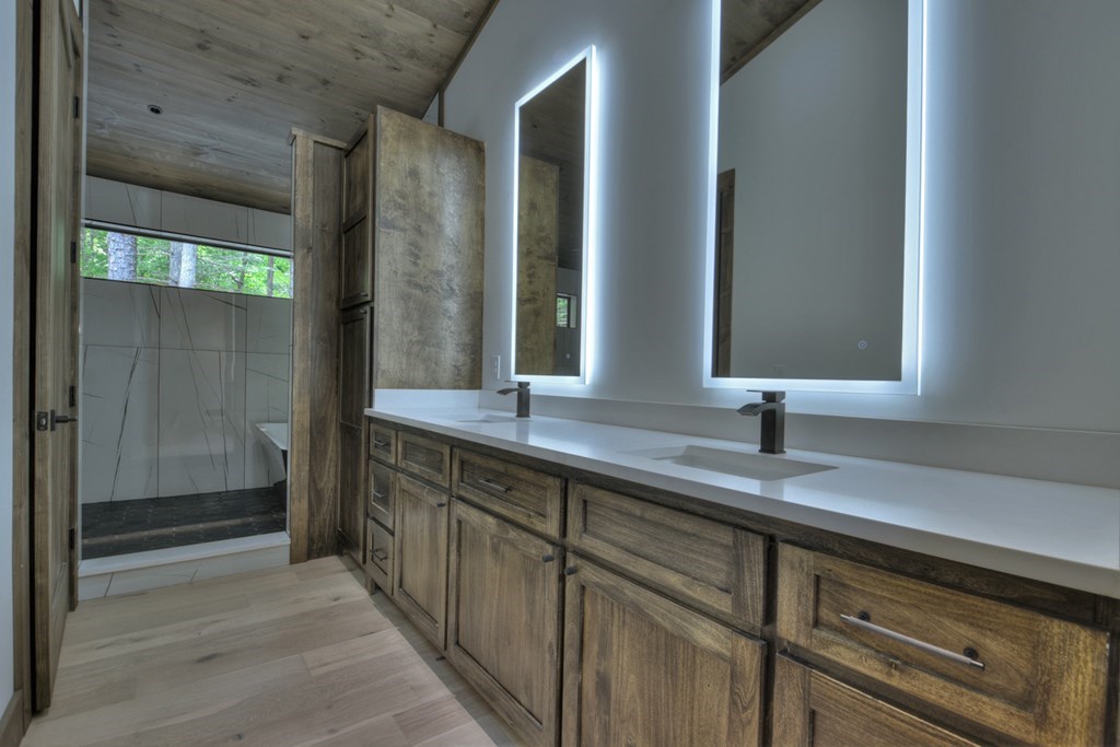 2596 Hwy 2 Blue Ridge Blue Ridge, GA 30513 - Photo 24 of 56 a bathroom with a double vanity sink and mirror