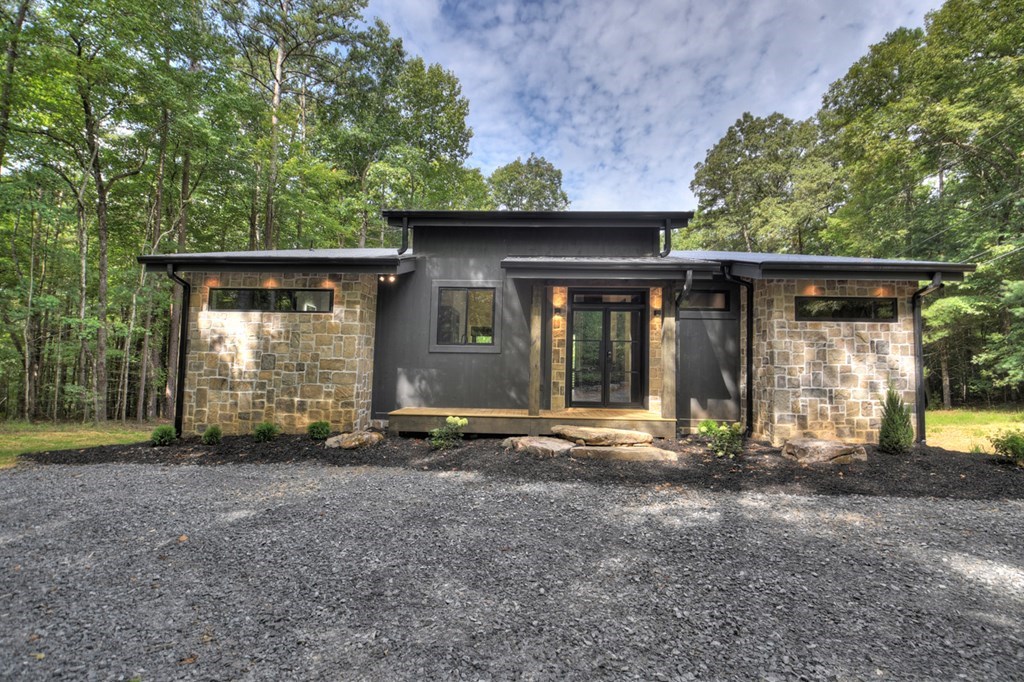 2596 Hwy 2 Blue Ridge Blue Ridge, GA 30513 - Photo 3 of 56 a front view of a house with garden