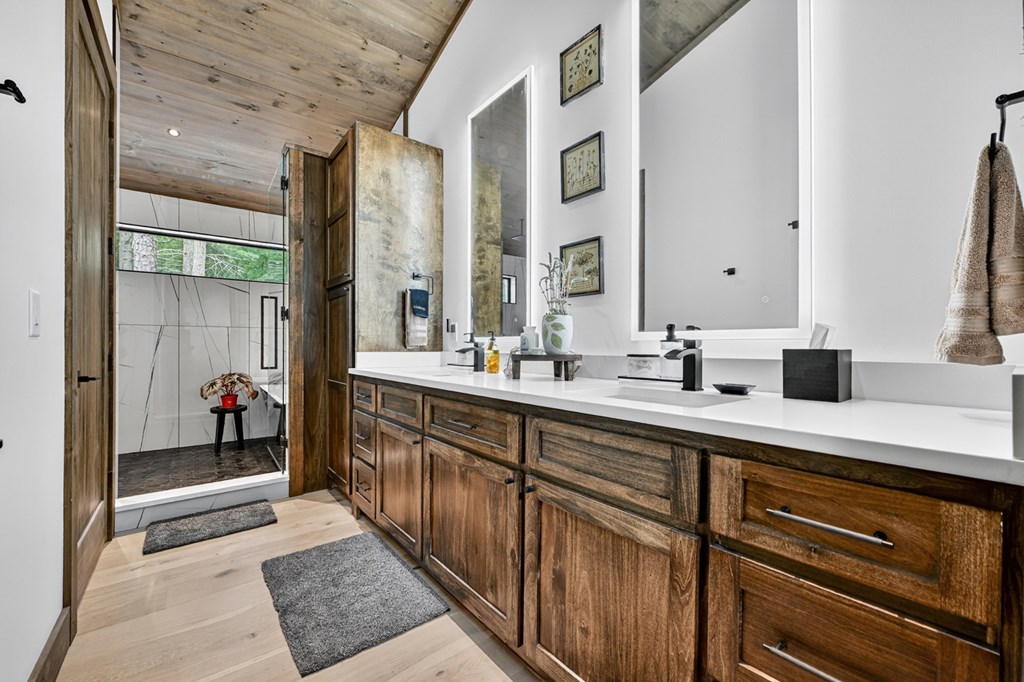 2596 Hwy 2 Blue Ridge Blue Ridge, GA 30513 - Photo 35 of 56 a spacious bathroom with a double vanity sink and a mirror