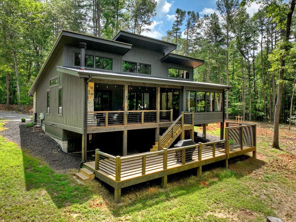 2596 Hwy 2 Blue Ridge Blue Ridge, GA 30513 - Photo 50 of 56 a view of a house with a wooden deck and a yard
