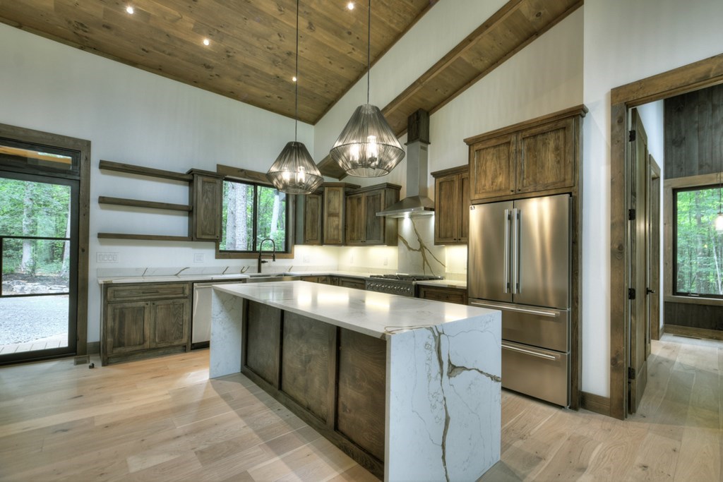 2596 Hwy 2 Blue Ridge Blue Ridge, GA 30513 - Photo 7 of 56 a kitchen with stainless steel appliances granite countertop a sink and a refrigerator