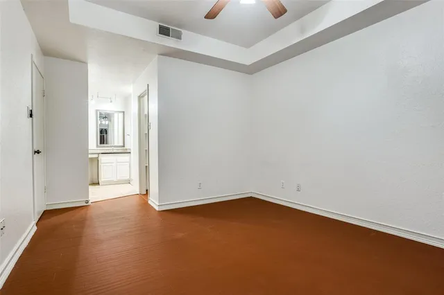 an empty room with a empty space and windows