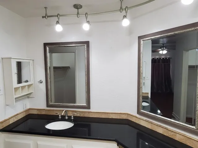 a bathroom with a sink and a mirror