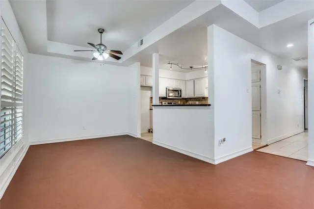a view of a kitchen with electric appliances
