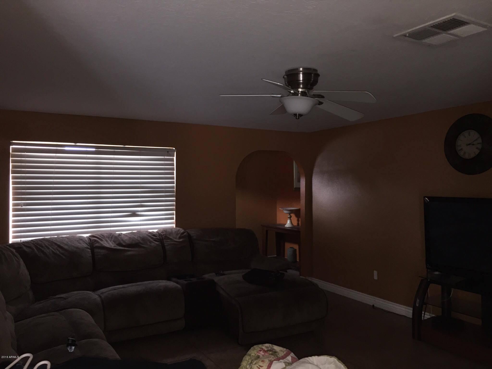 5952 West Berkeley Road Phoenix, AZ 85035 - Photo 6 of 19 a view of a livingroom with furniture and a window