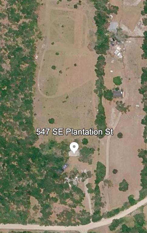 547 Southeast Plantation Street Lee, FL 32059 - Photo 1 of 1 a sign that is sitting on a wooden floor