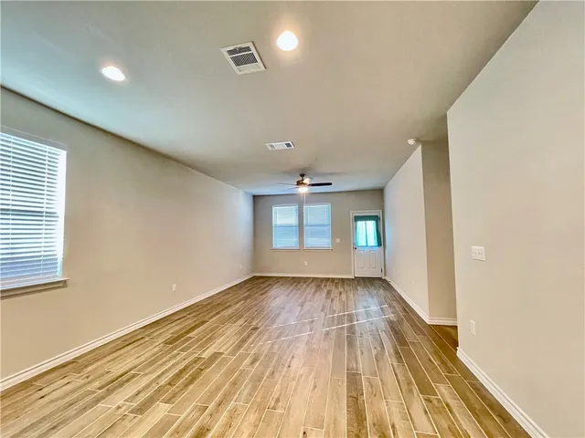 a view of an empty room and window