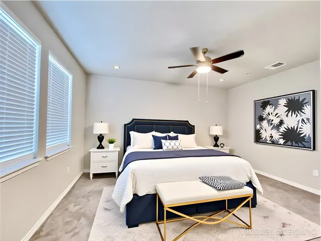 a bedroom with bed and a chandelier