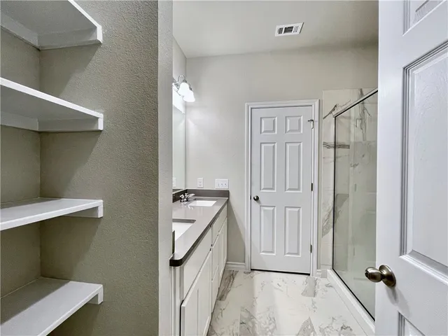 a view of a hallway with closet