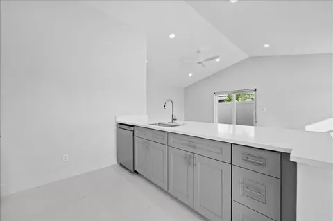 a bathroom with a double vanity sink and mirror