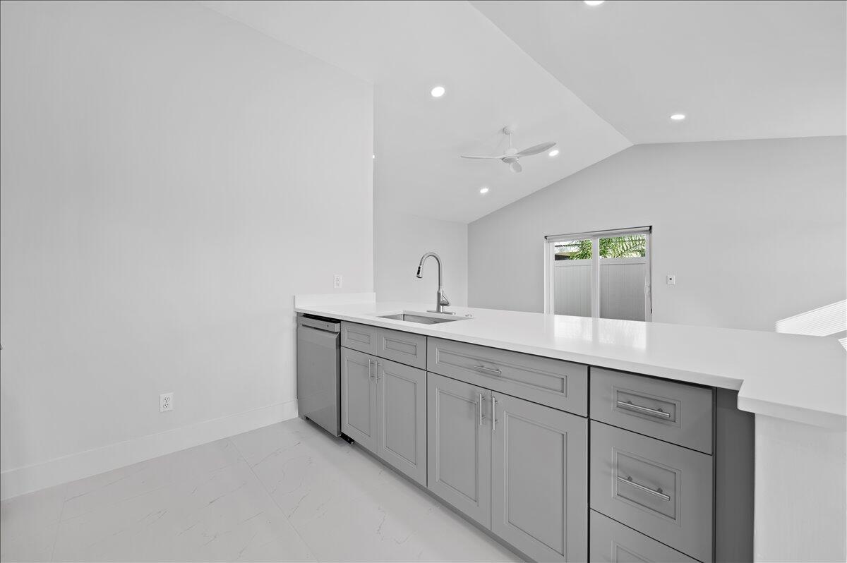 196 Raintree Trail Jupiter, FL 33458 - Photo 11 of 26 a bathroom with a double vanity sink and mirror