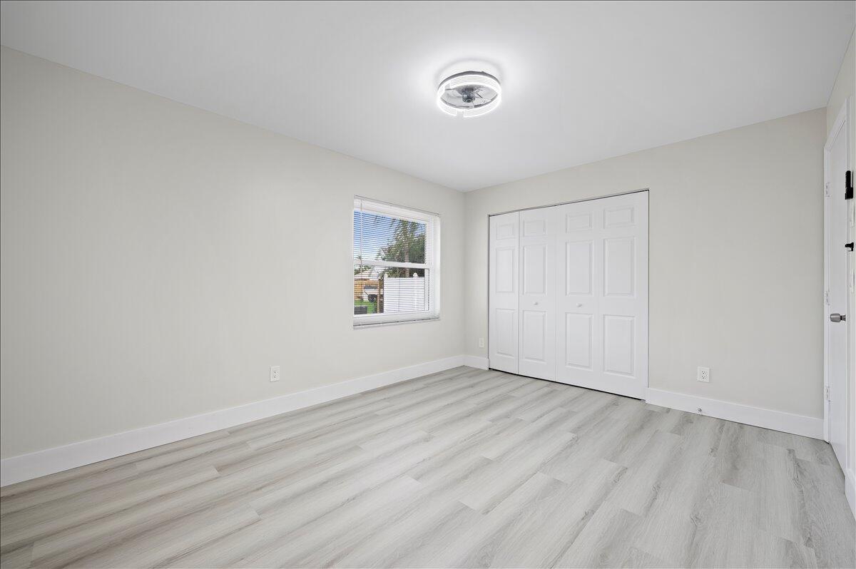 196 Raintree Trail Jupiter, FL 33458 - Photo 14 of 26 wooden floor in an empty room