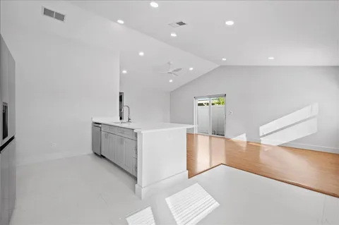 a view of a kitchen with a sink