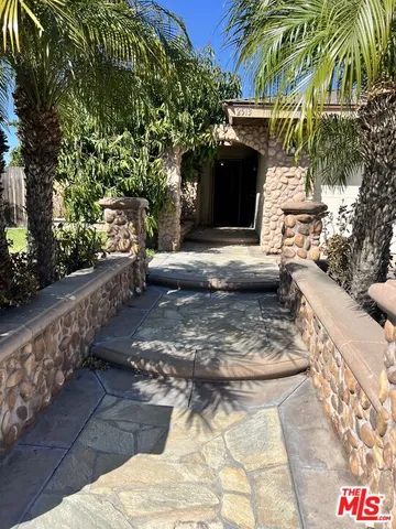 a view of a yard along with trees