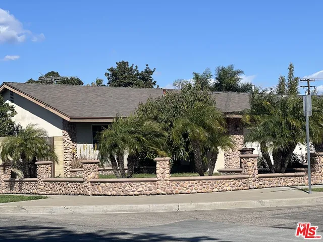 a view of a house with a street