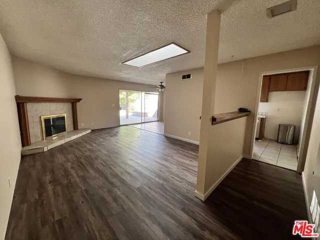 a view of a living room a dining room and wooden floor