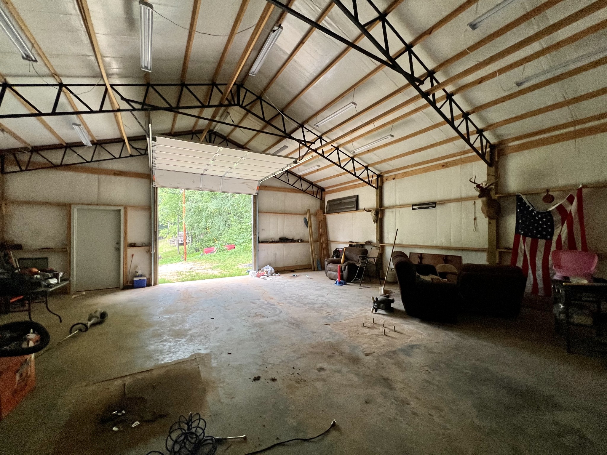 1173 Cedar Hurst Lane Pulaski, TN 38478 - Photo 8 of 9 a bed room with a bed and a large window