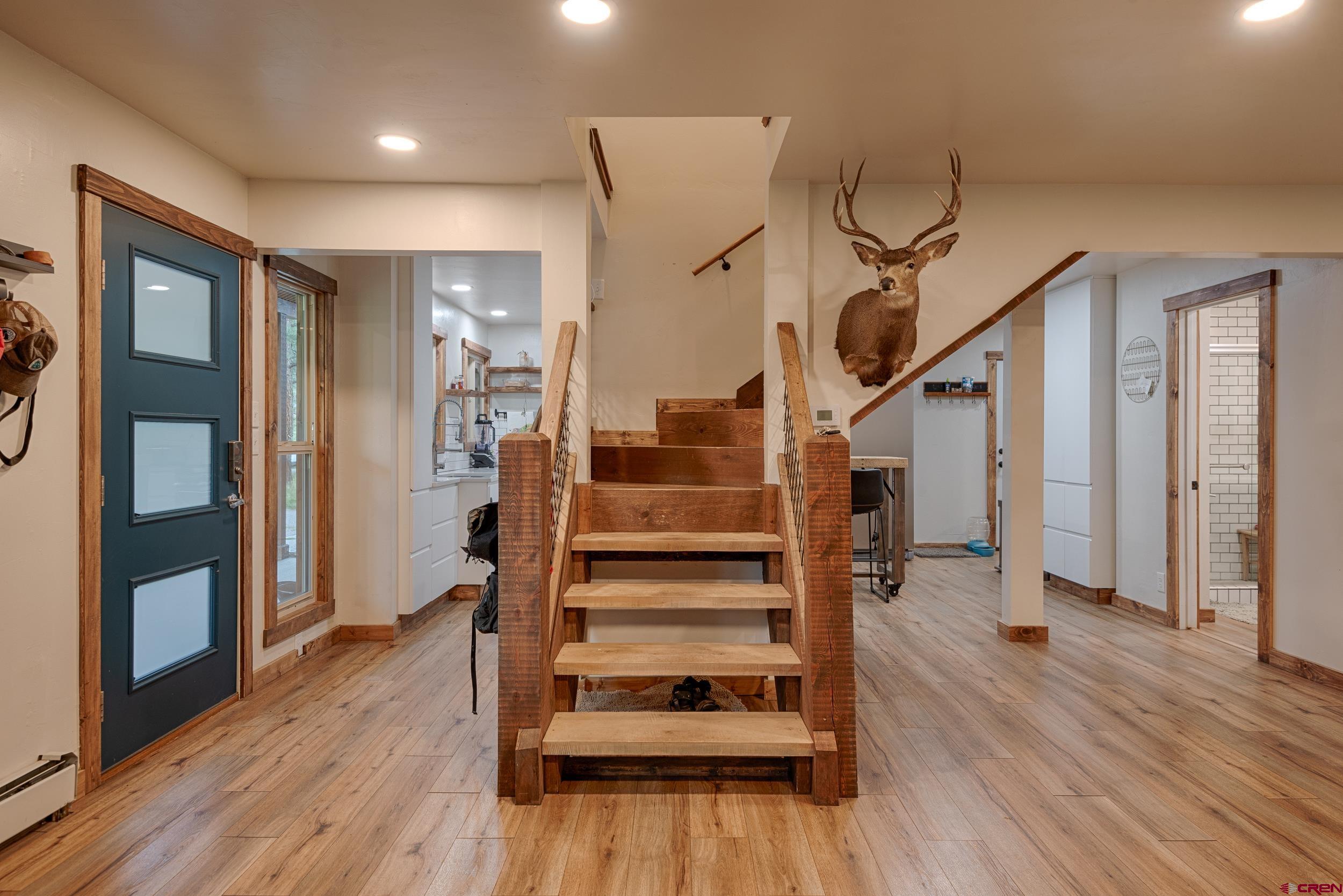 559 Suzanne Lane Ridgway, CO 81432 - Photo 21 of 45 a view of entryway and hall with wooden floor