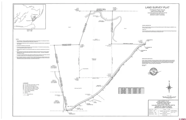 a view of a covered with trees in the background