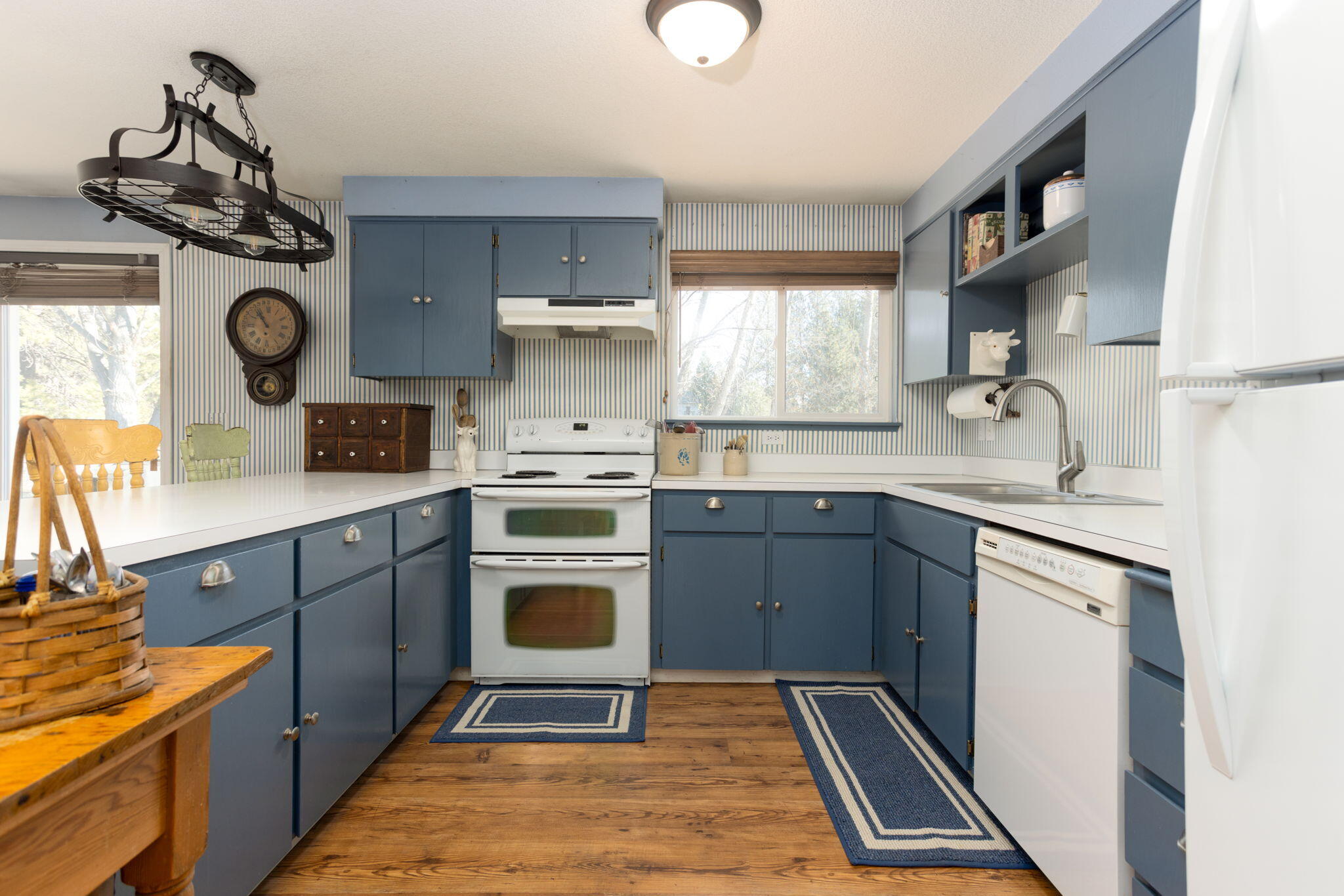 19450 Calico Road Bend, OR 97702 - Photo 10 of 41 a kitchen with a refrigerator and a stove top oven