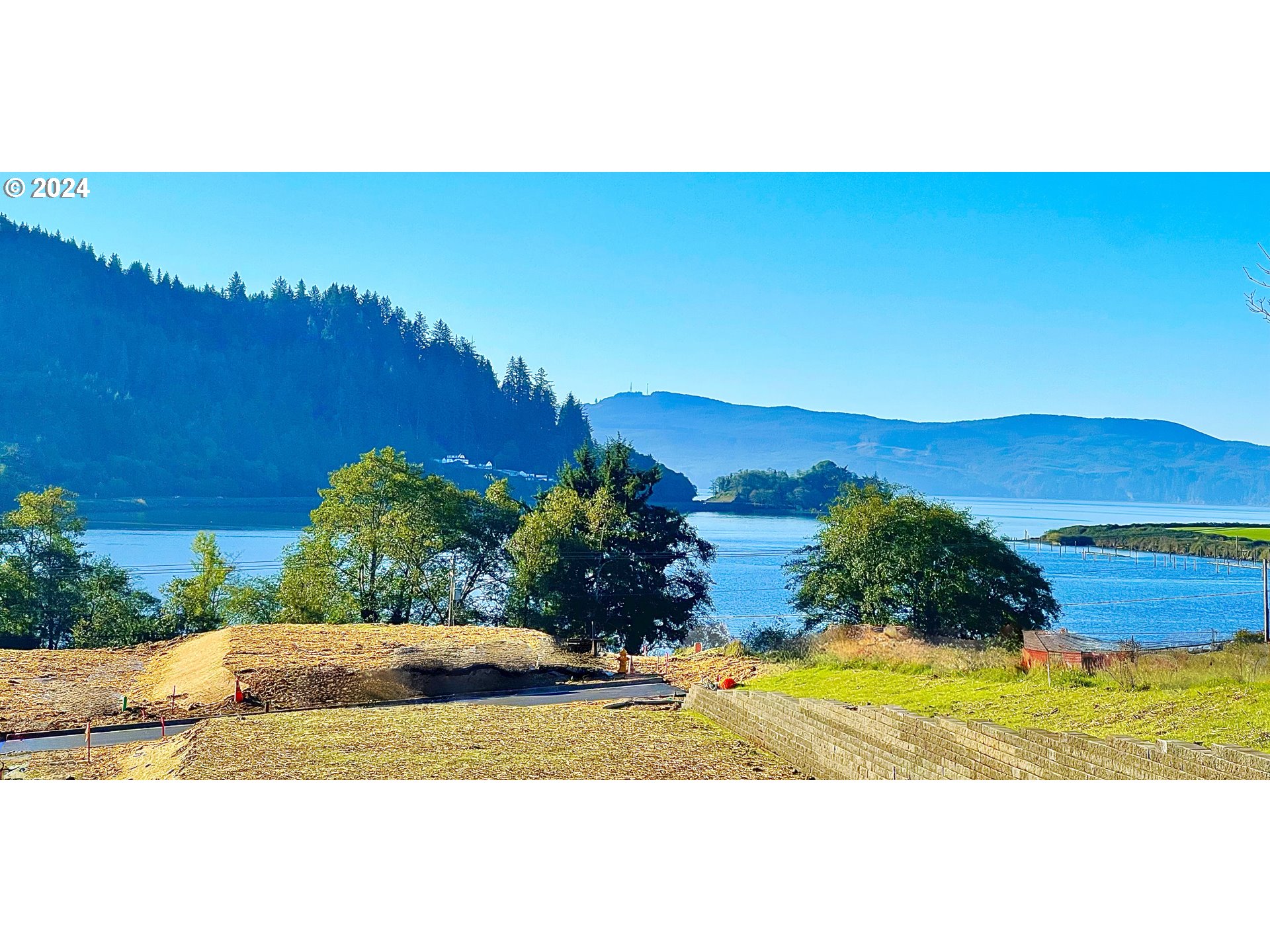 501 Garibaldi Avenue, Unit 4 Garibaldi, OR 97118 - Photo 19 of 22 a view of a swimming pool with an outdoor space and seating area