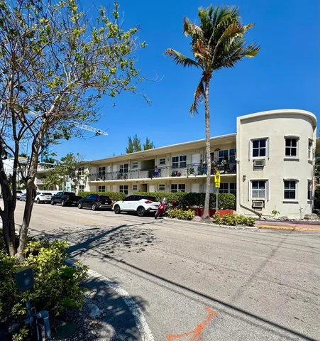 a view of a street with cars