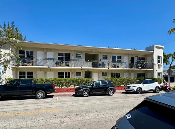 a view of a cars parked in front of a building