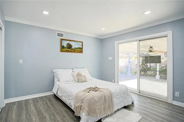 a bedroom with a large bed and a large window