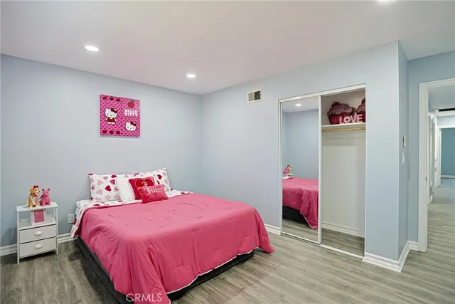 a bedroom with a bed and a closet