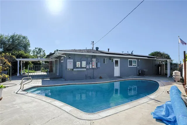 a view of a house with swimming pool