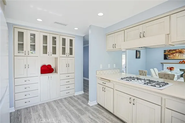a kitchen with cabinets appliances