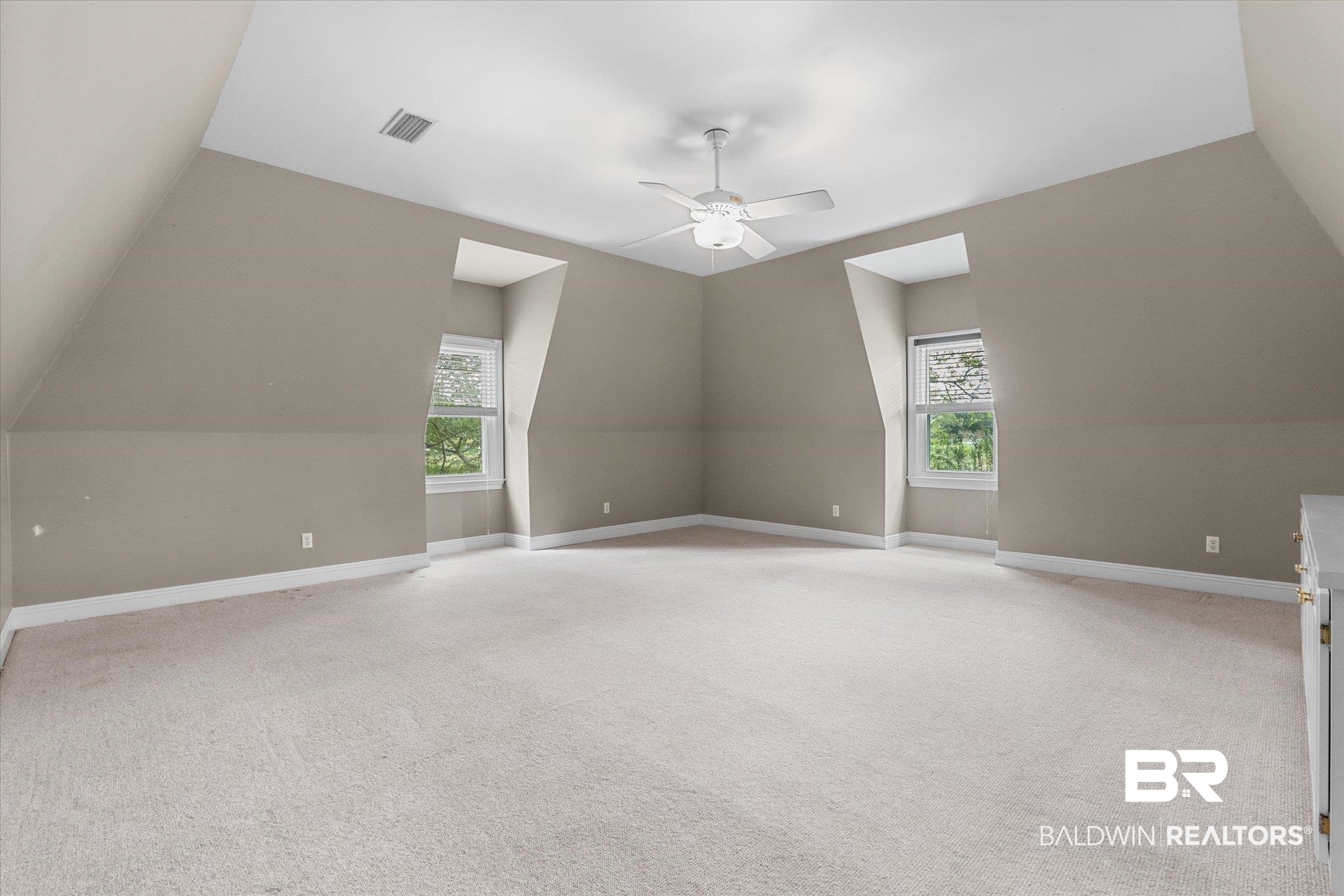 5231 Dawes Road Grand Bay, AL 36541 - Photo 26 of 49 Bonus room featuring ceiling fan, lofted ceiling, plenty of natural light, and light carpet