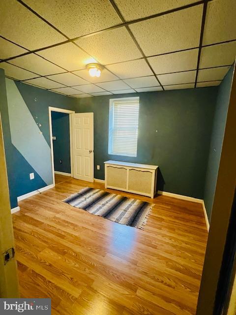 1117 McKean Street, Unit A Philadelphia, PA 19148 - Photo 5 of 14 a bedroom with a bed and wooden floor