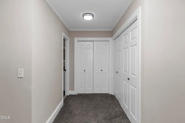 a view of a hallway with closet area
