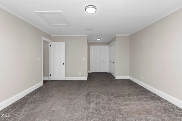 an empty room with closet area
