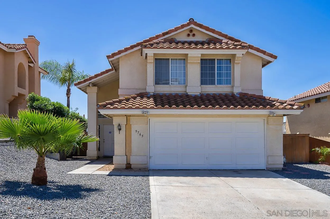 a front view of a house with yard