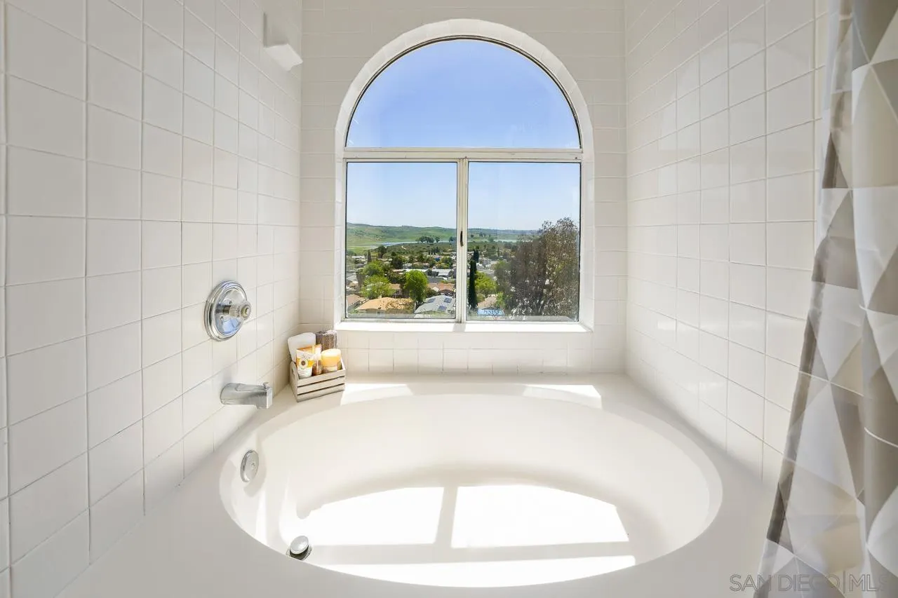 9765 Avenida Ricardo Spring Valley, CA 91977 - Photo 23 of 41 a picture of a bath tub sitting in a bathroom