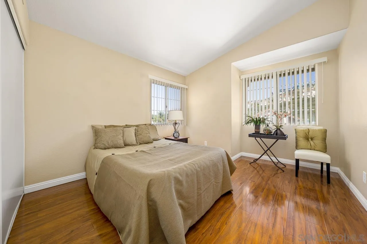 9765 Avenida Ricardo Spring Valley, CA 91977 - Photo 24 of 41 a bed room with a bed and a chair