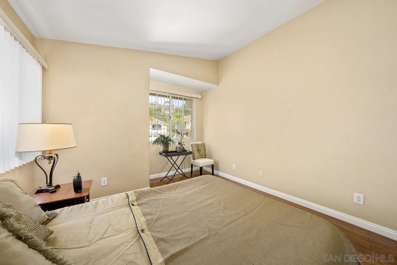9765 Avenida Ricardo Spring Valley, CA 91977 - Photo 25 of 41 a bedroom with a bed and a window