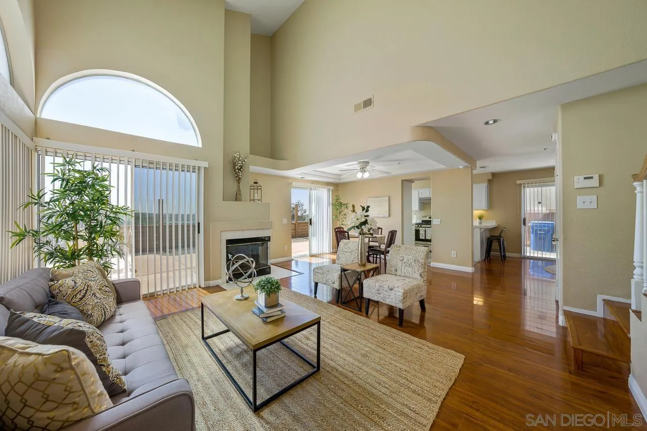9765 Avenida Ricardo Spring Valley, CA 91977 - Photo 3 of 41 a living room with furniture a fireplace and a large window