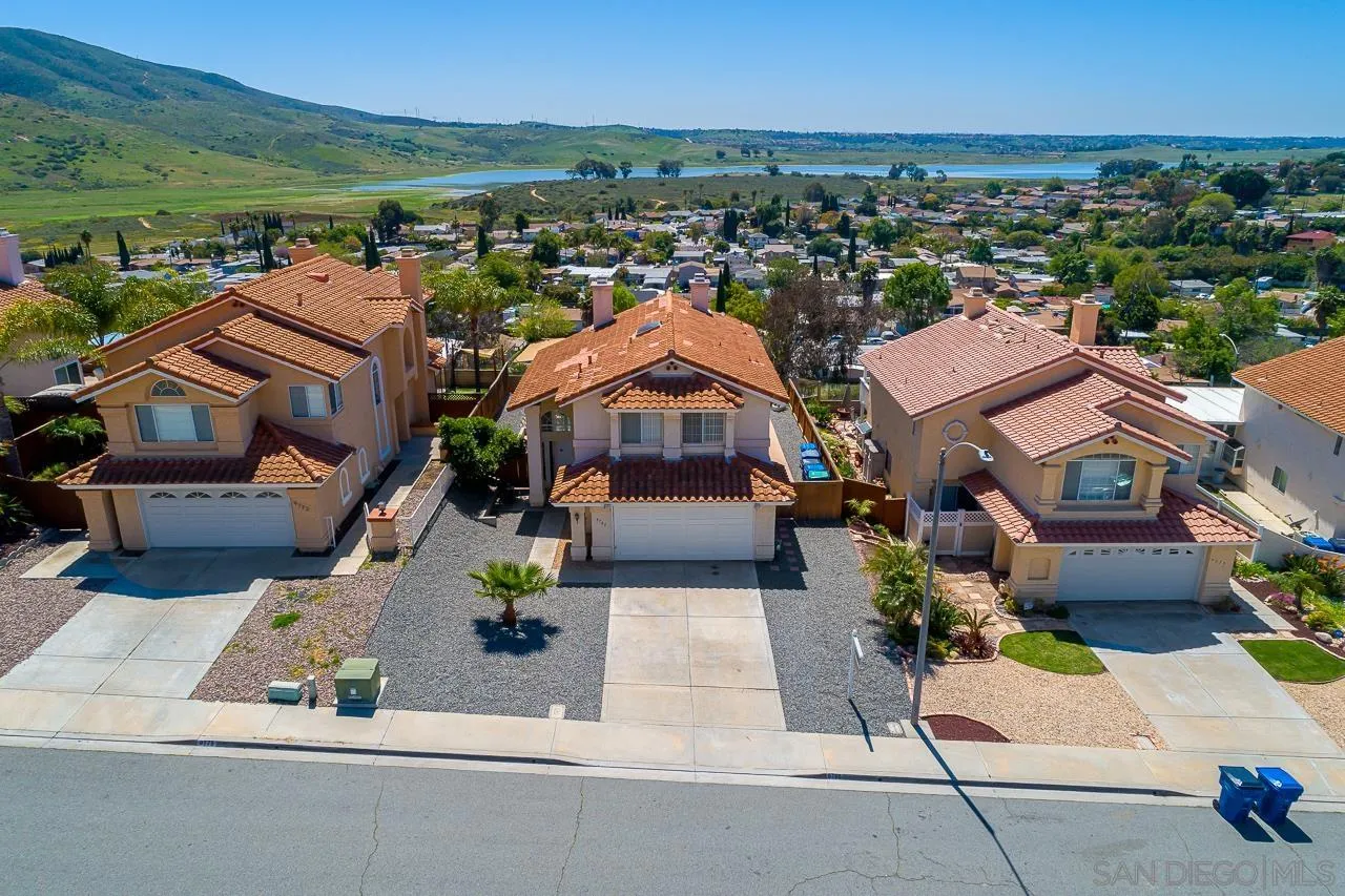 9765 Avenida Ricardo Spring Valley, CA 91977 - Photo 40 of 41 an aerial view of multiple houses with a yard