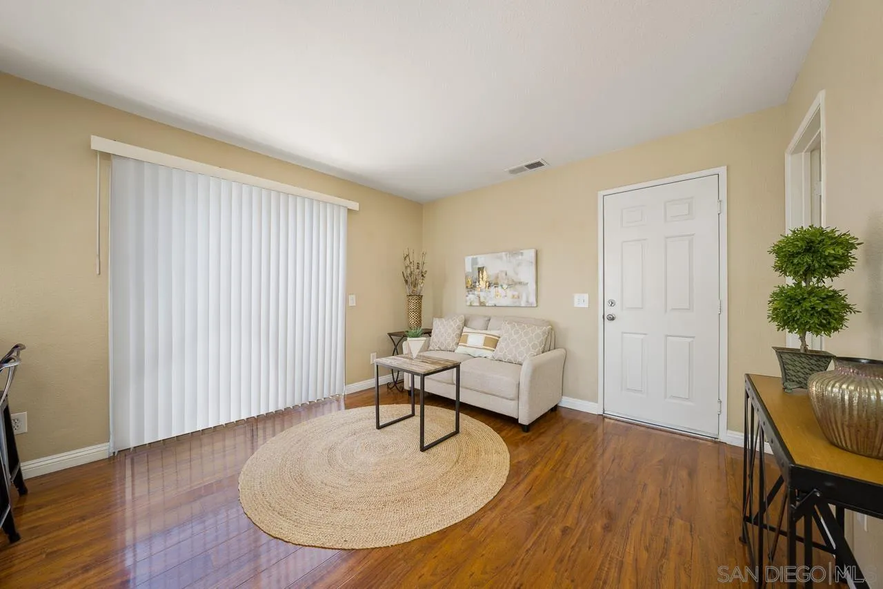 9765 Avenida Ricardo Spring Valley, CA 91977 - Photo 8 of 41 a living room with furniture and a wooden floor