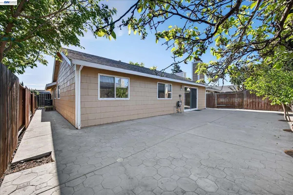 a backyard of a house with lots of tree