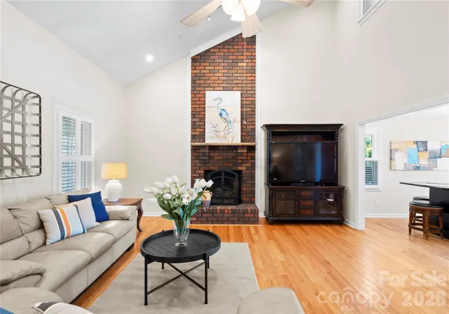 a kitchen with stainless steel appliances granite countertop a stove a sink and a wooden cabinets