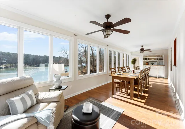 a view of a dining room with furniture window and wooden floor