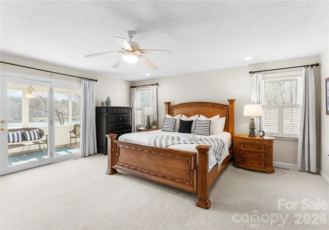 a bed room with a bed and a chandelier