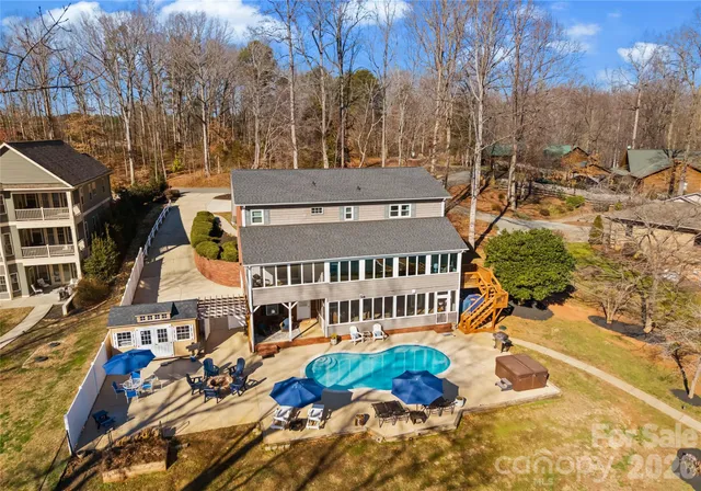 an aerial view of a house with a ocean view