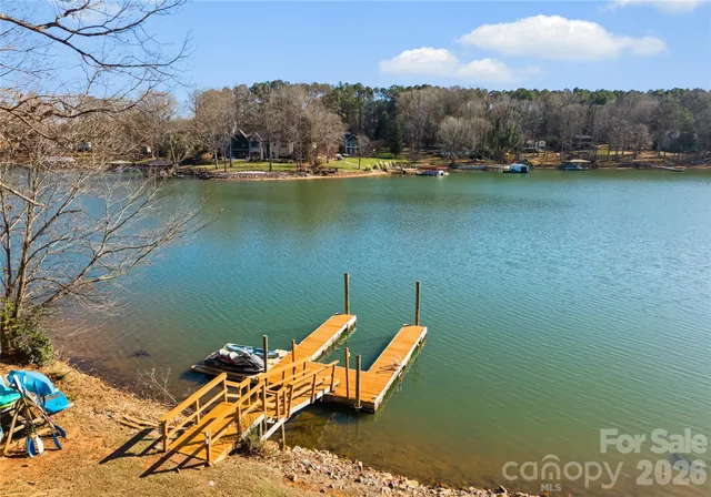 a swimming pool with outdoor seating and yard